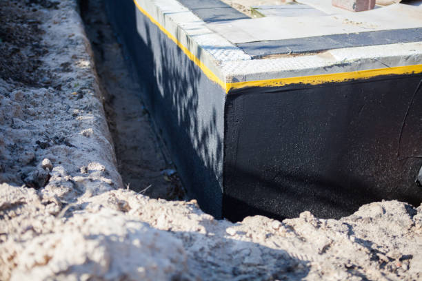 Professional Basement Waterproofing technician working in Topeka, KS